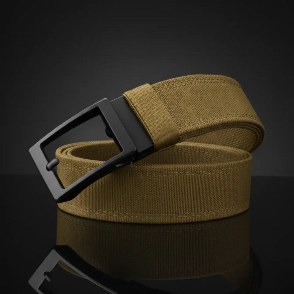 The Pomence Ratchet Tactical Belt in Tan, coiled packshot with the matte black metal buckle