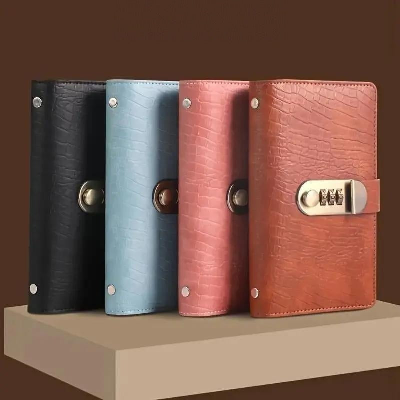 Four Pomence Savings Binders standing in a row in black, blue, pink and brown