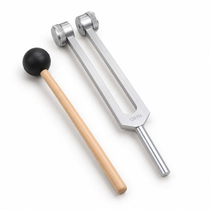 The Pomence 128 Hz Weighted Tuning Fork and its wooden mallet alone on a plain near white ground