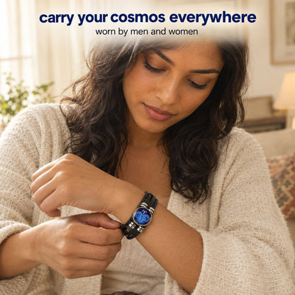 A woman fastening the Pomence Zodiac Leather Bracelet on her wrist at home, the glass zodiac dome sitting on top of the wrist