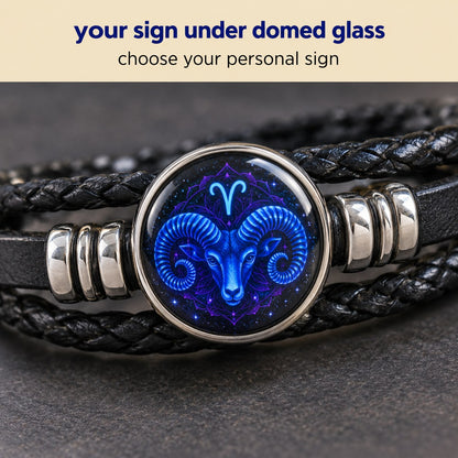 Macro of the glass zodiac dome on the Pomence Zodiac Leather Bracelet, captioned twelve zodiac signs available