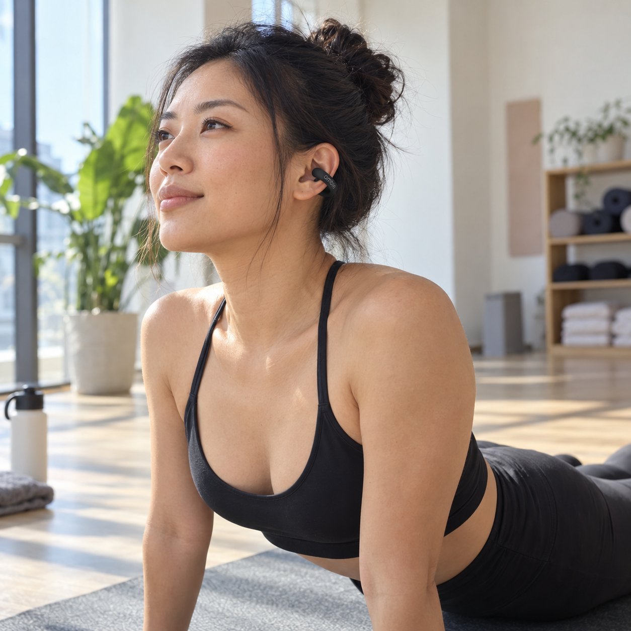 Woman doing yoga wearing the black earcuff