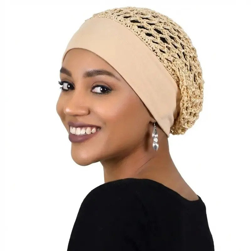A woman wearing the khaki Pomence sleeping bonnet