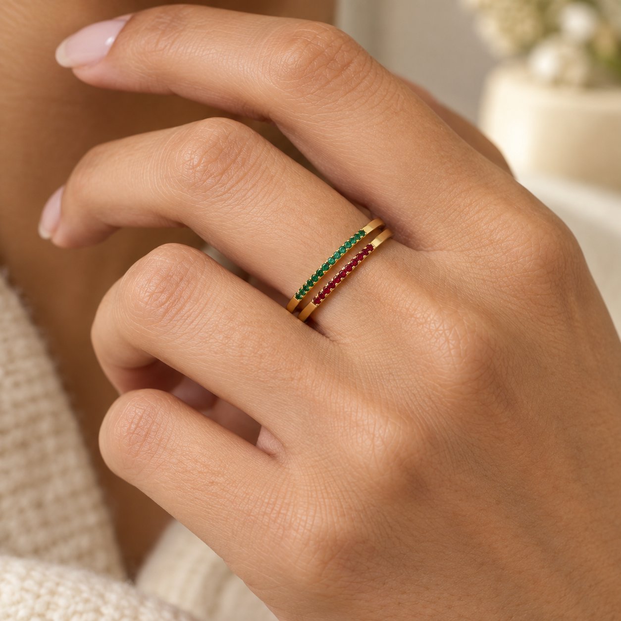 Twelve Pomence Birthstone Stacking Ring bands shown side by side, one in each birth month color