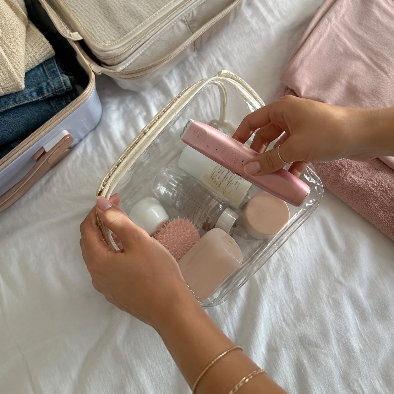 Woman packing the Pomence 2-in-1 Bikini Trimmer into a travel bag