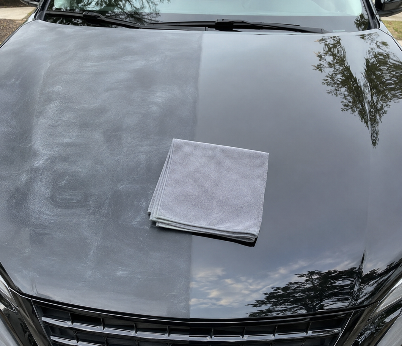 Car hood half restored with Car Cloth resting on it