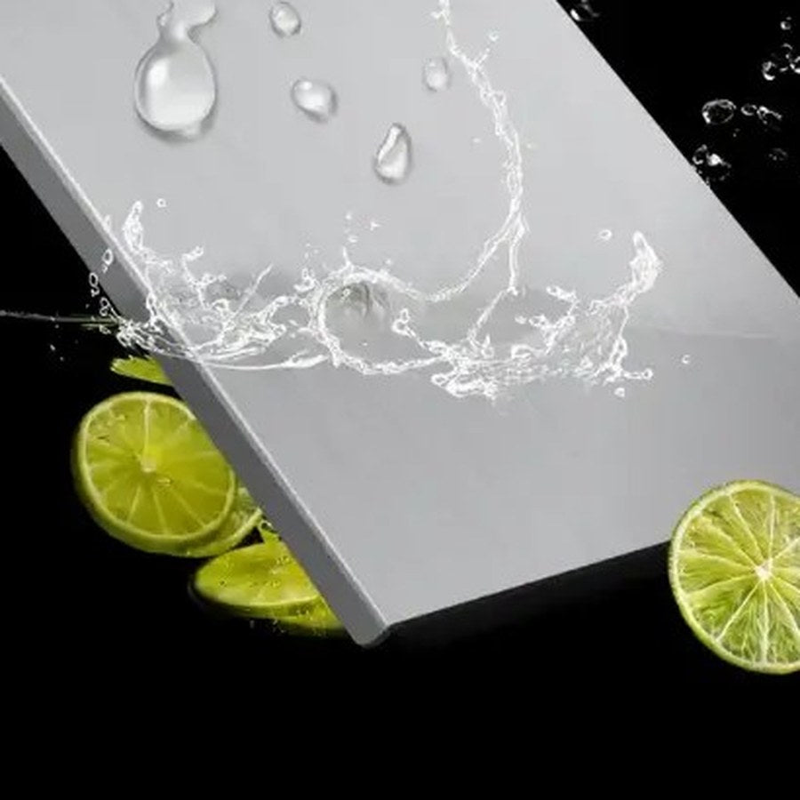 Water splashing off the stainless steel chopping board surface