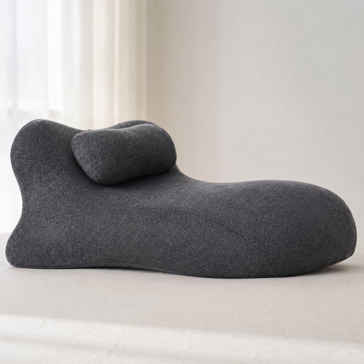 Close-up of the curved wedge shape of the Pomence Couples Comfort Pillow
