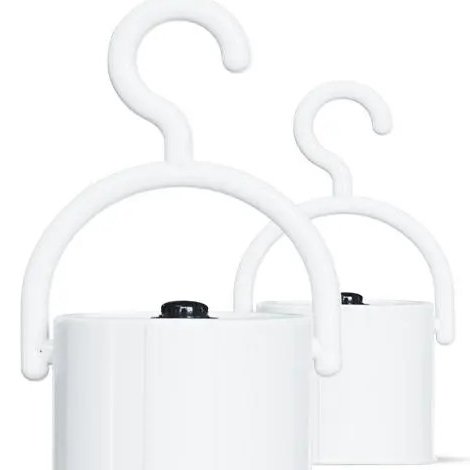 Two white hook covers with the on and off button on top