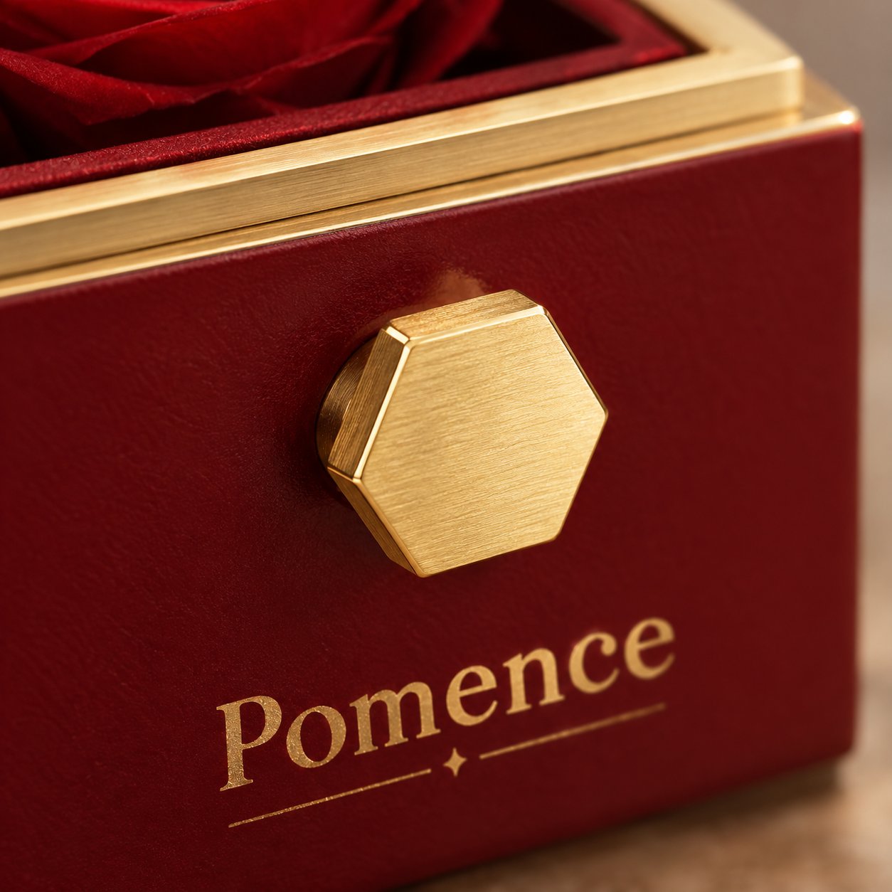 The clear lid and gold trim of the box