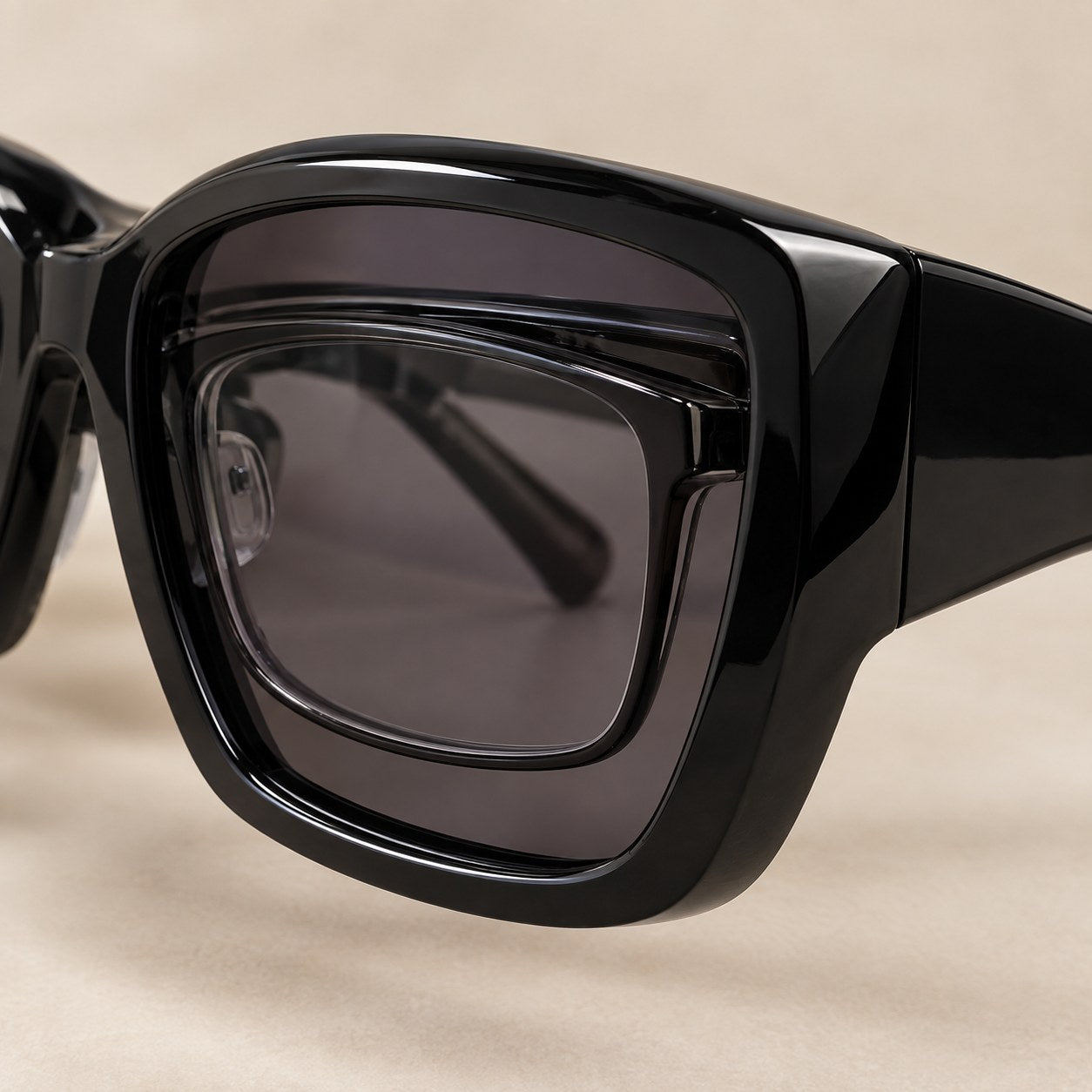 Macro of the deep front of the Pomence Fit-Over Sunglasses with a clear prescription frame sitting inside it
