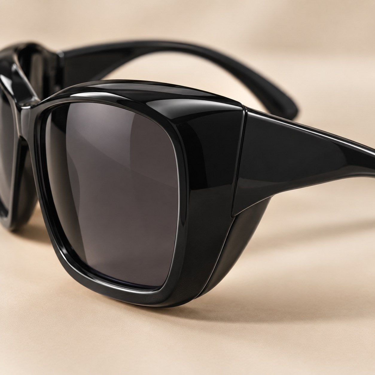 Macro of the wraparound side of the Pomence Fit-Over Sunglasses curving back along the temple