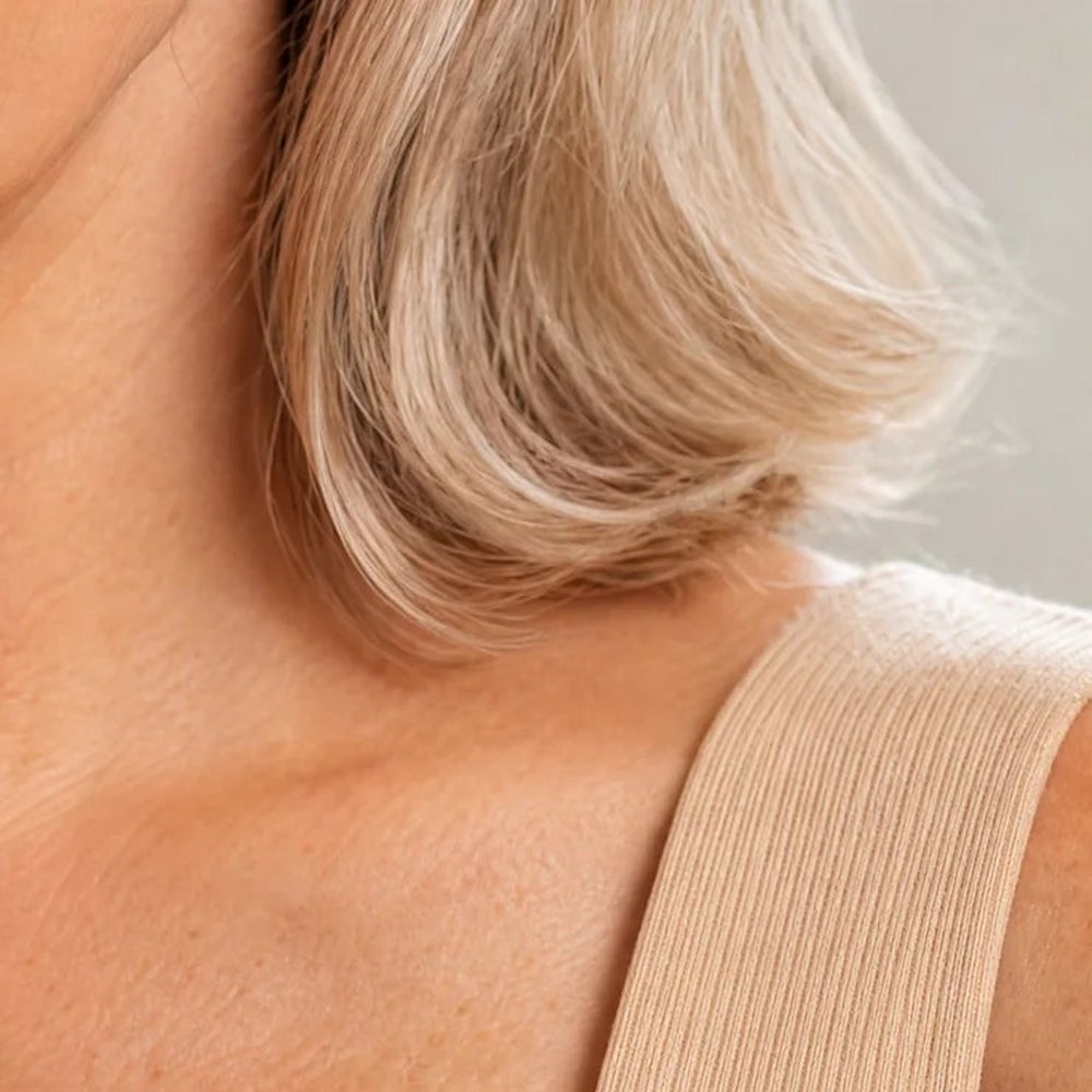 The wide strap of the Pomence Front-Support Bra Tank lying flat on a shoulder