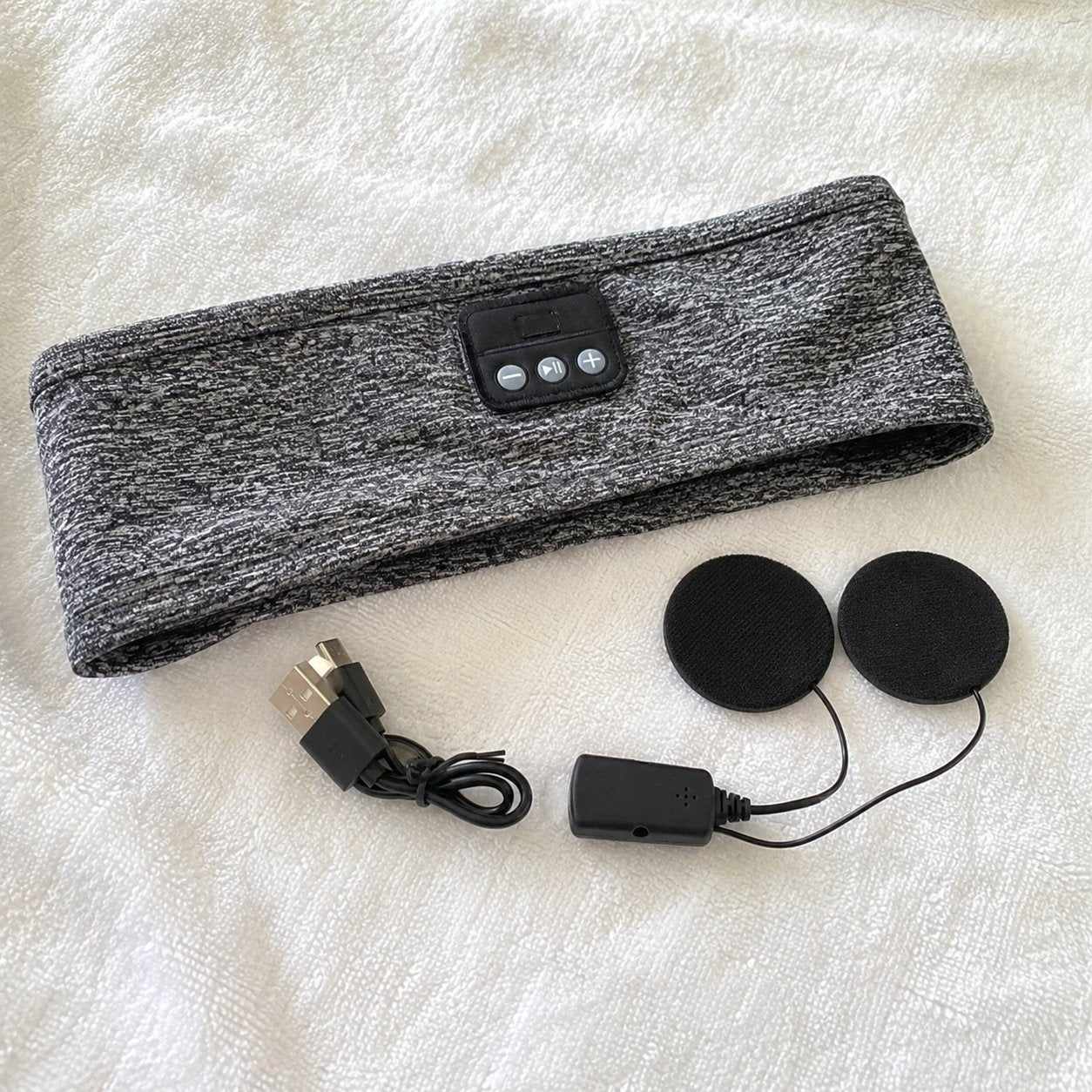 The speaker module pulled out of the headband for washing