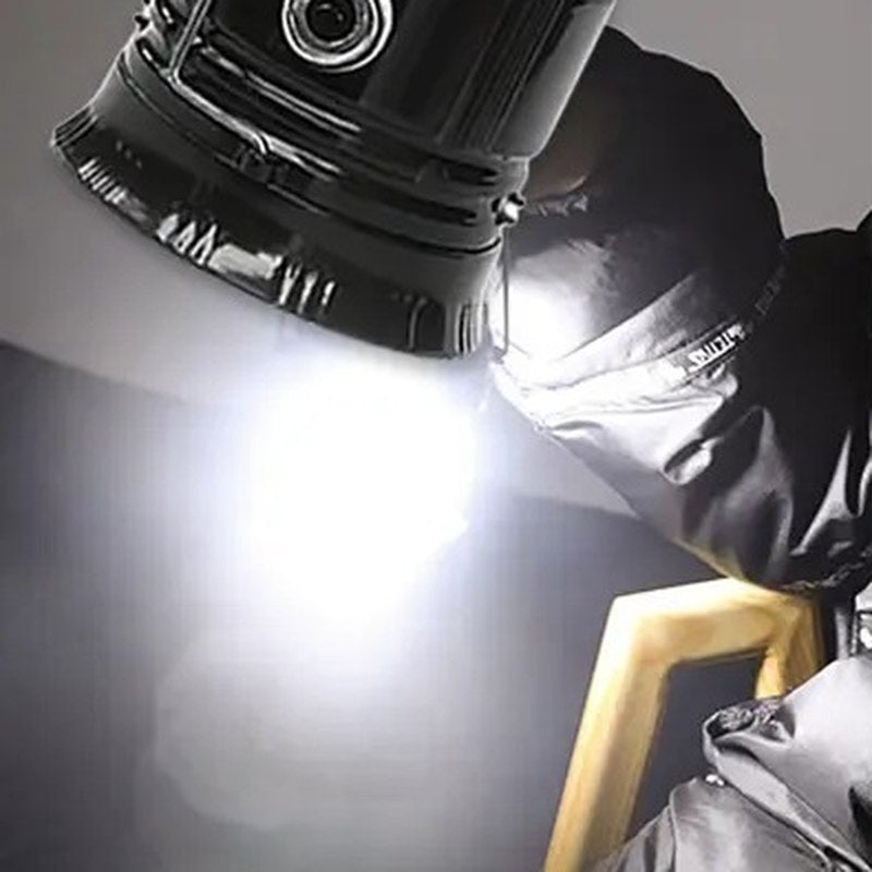 The flashlight in the base of the lantern shining down