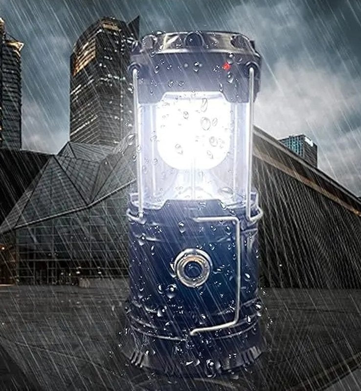 The lit Pomence collapsible LED lantern shining in a rain storm