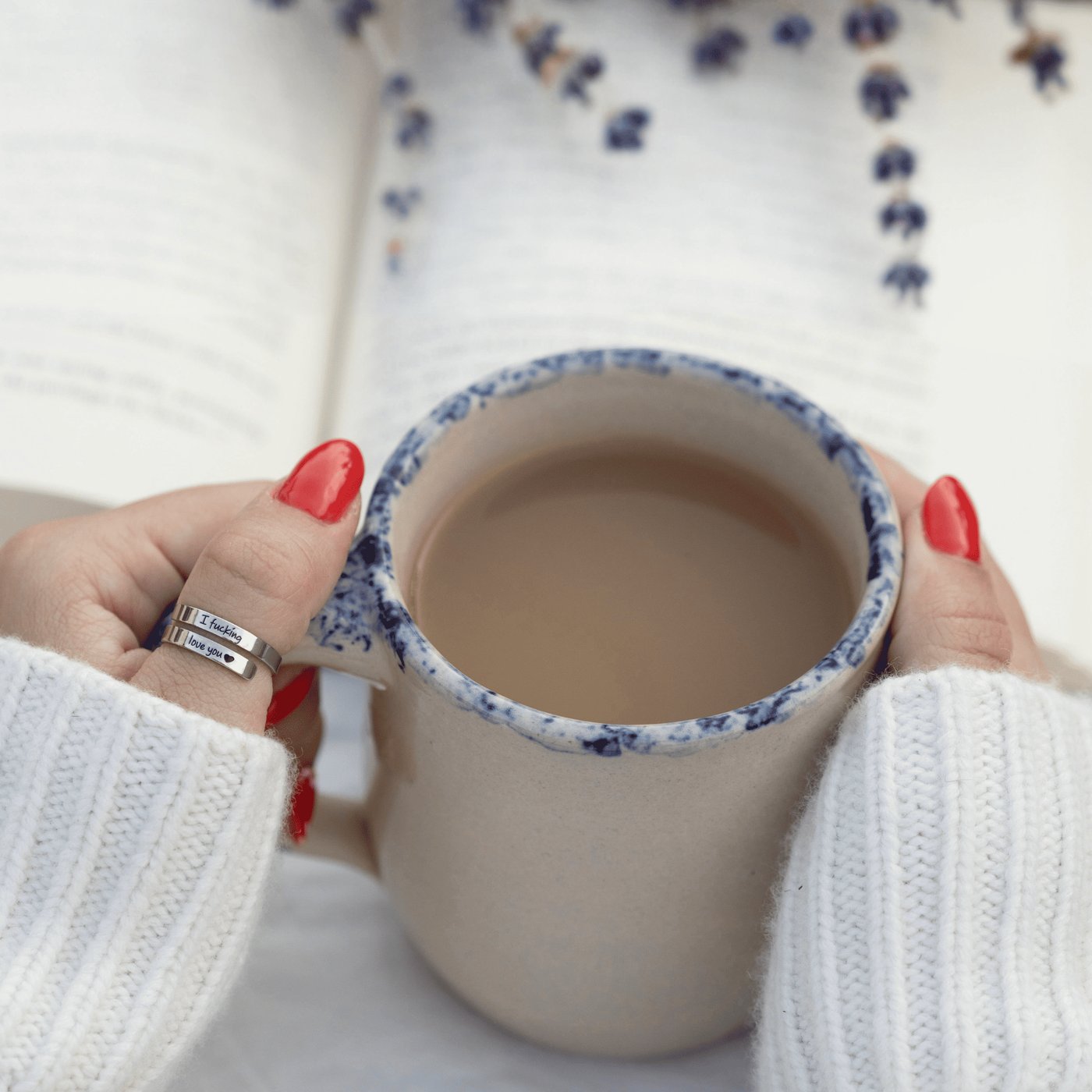 The Pomence I F♡cking Love You Ring worn every day, on a hand holding a mug