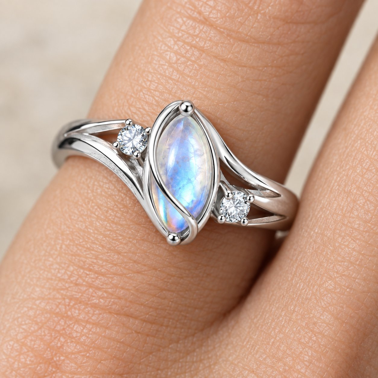 The Pomence Moonstone Ring worn on a ring finger, shown at everyday scale