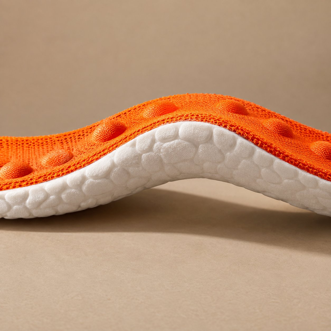 Scissors cutting along the printed trim guide at the toe of a Pomence Massage Insole