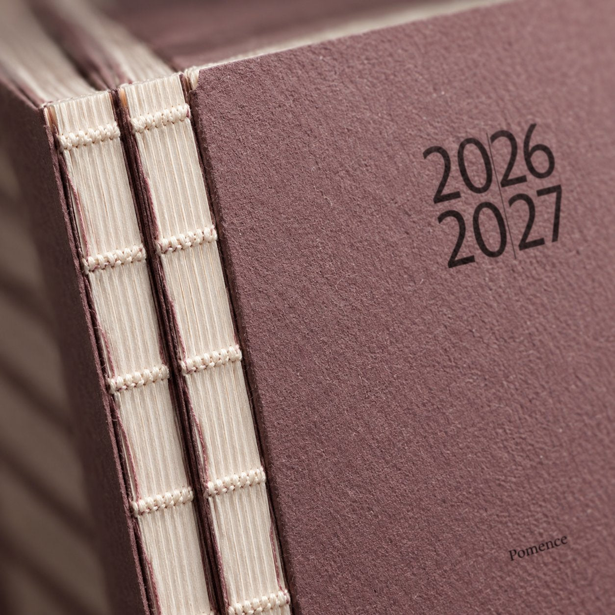 The mauve card cover with the years printed