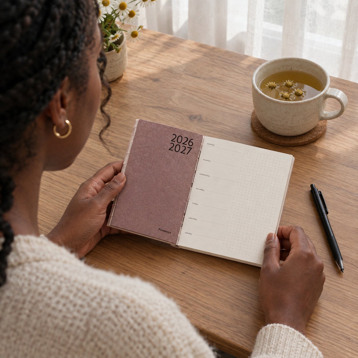 The planner on a desk with a pen