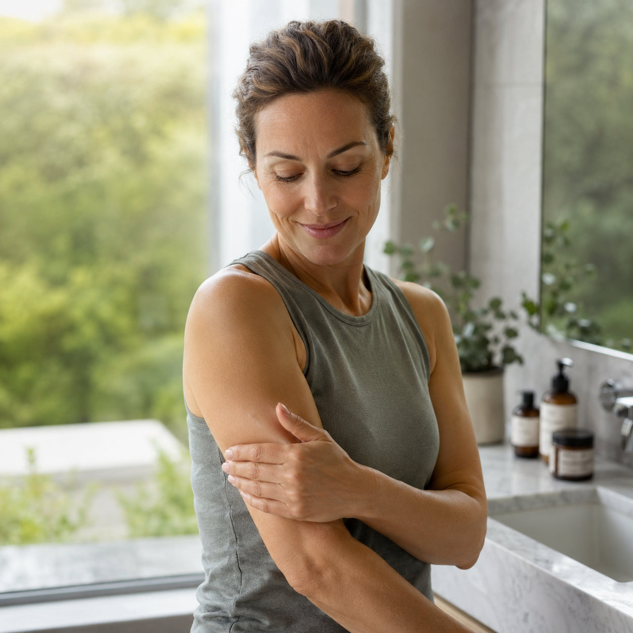 Woman with firmer-looking toned arm after her firming ritual