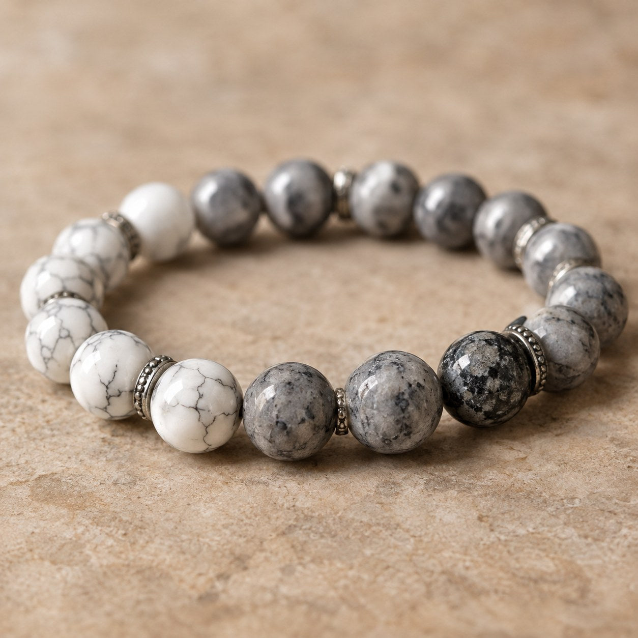 Close macro of the white and grey natural turquoise beads on the Pomence Pixiu Wealth Bracelet