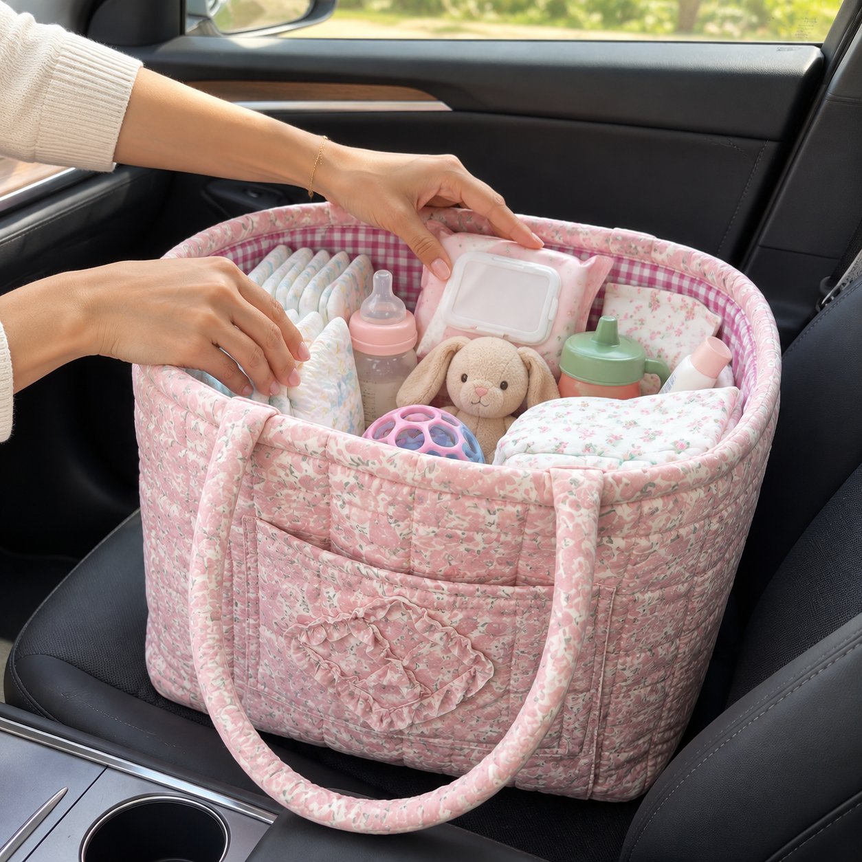 Pink quilted basket on a car front seat, filled with snacks and books