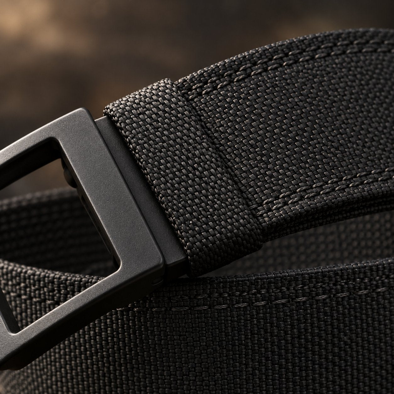Macro detail of the woven 1000D nylon webbing and edge stitching on the Pomence Ratchet Tactical Belt