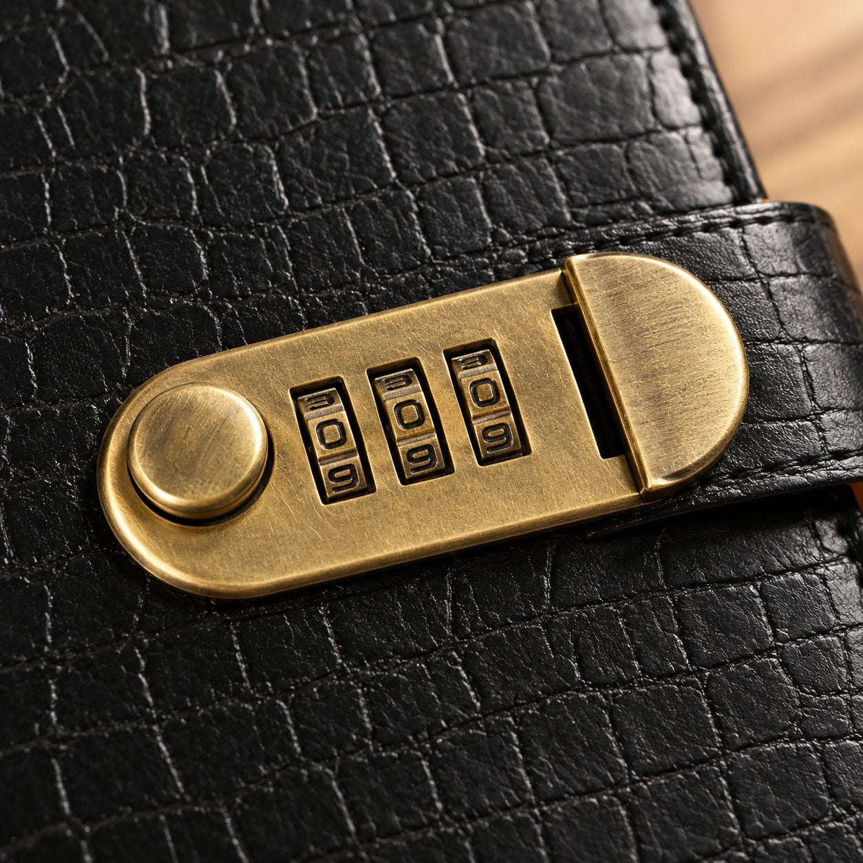 Close view of the brass 3-digit combination lock on the Pomence Savings Binder with Lock