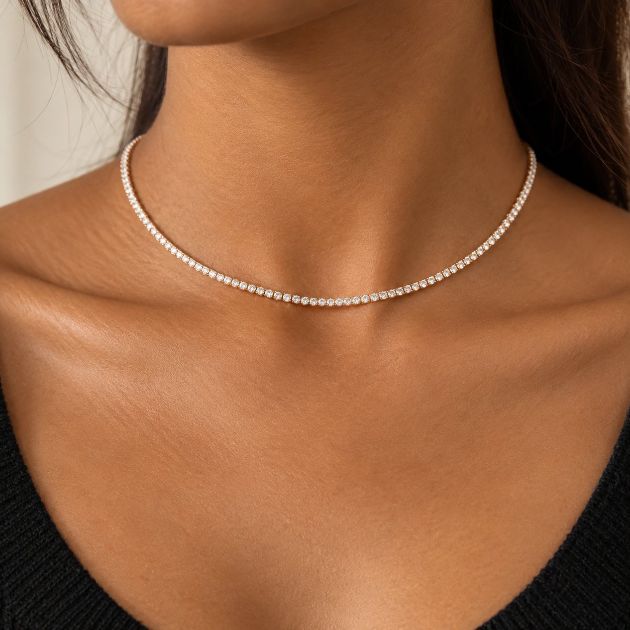 Close-up of the continuous row of 2mm round cubic zirconia stones on the Pomence Tennis Necklace