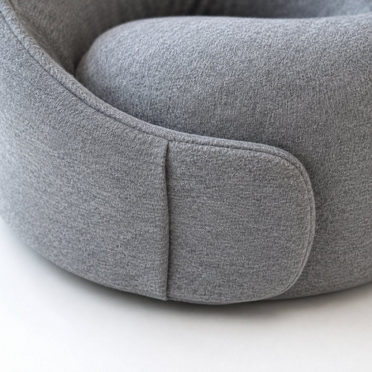 Close-up of the closed hook-and-loop seam on the Pomence Wrap Travel Neck Pillow