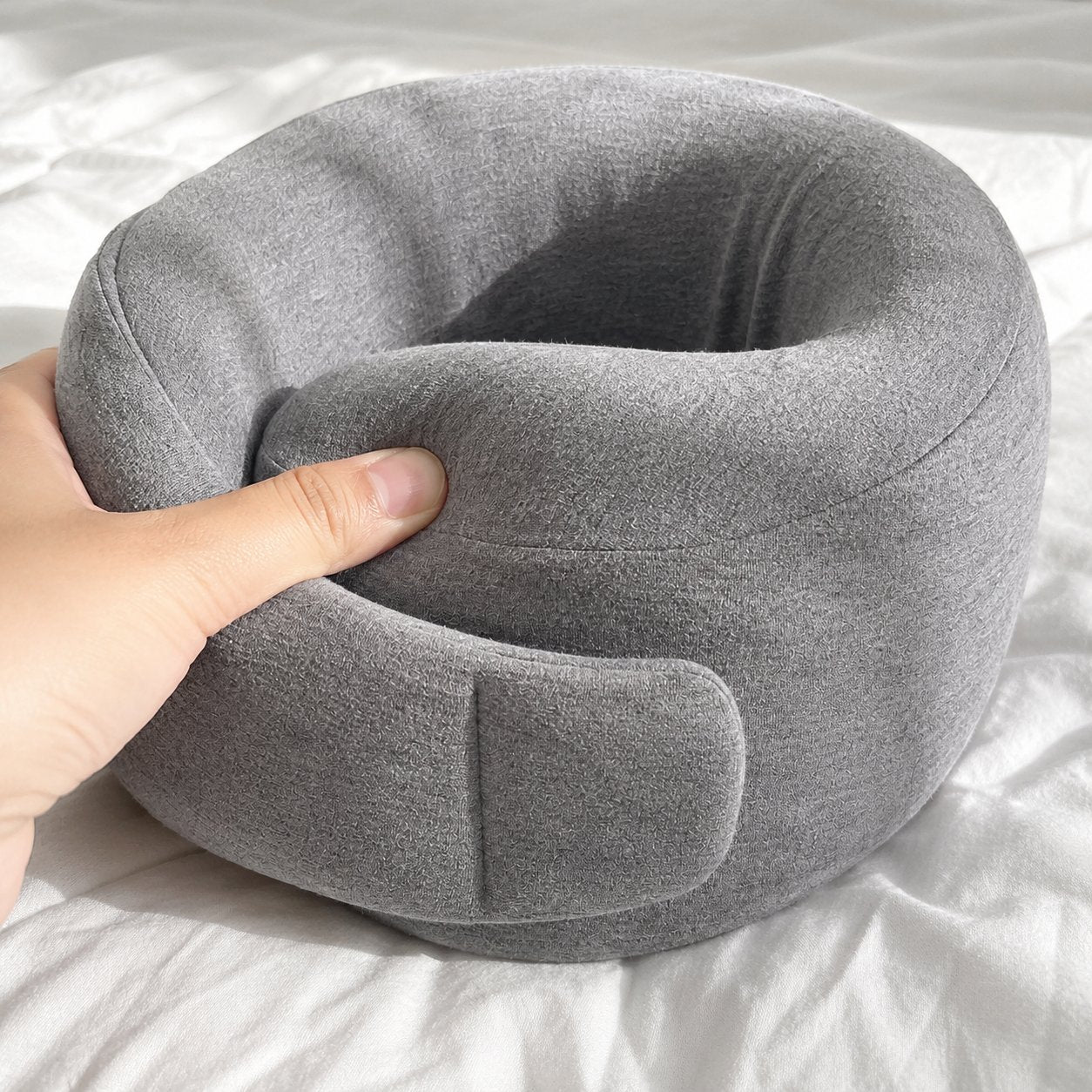 Close-up of the soft fabric of the Pomence Wrap Travel Neck Pillow