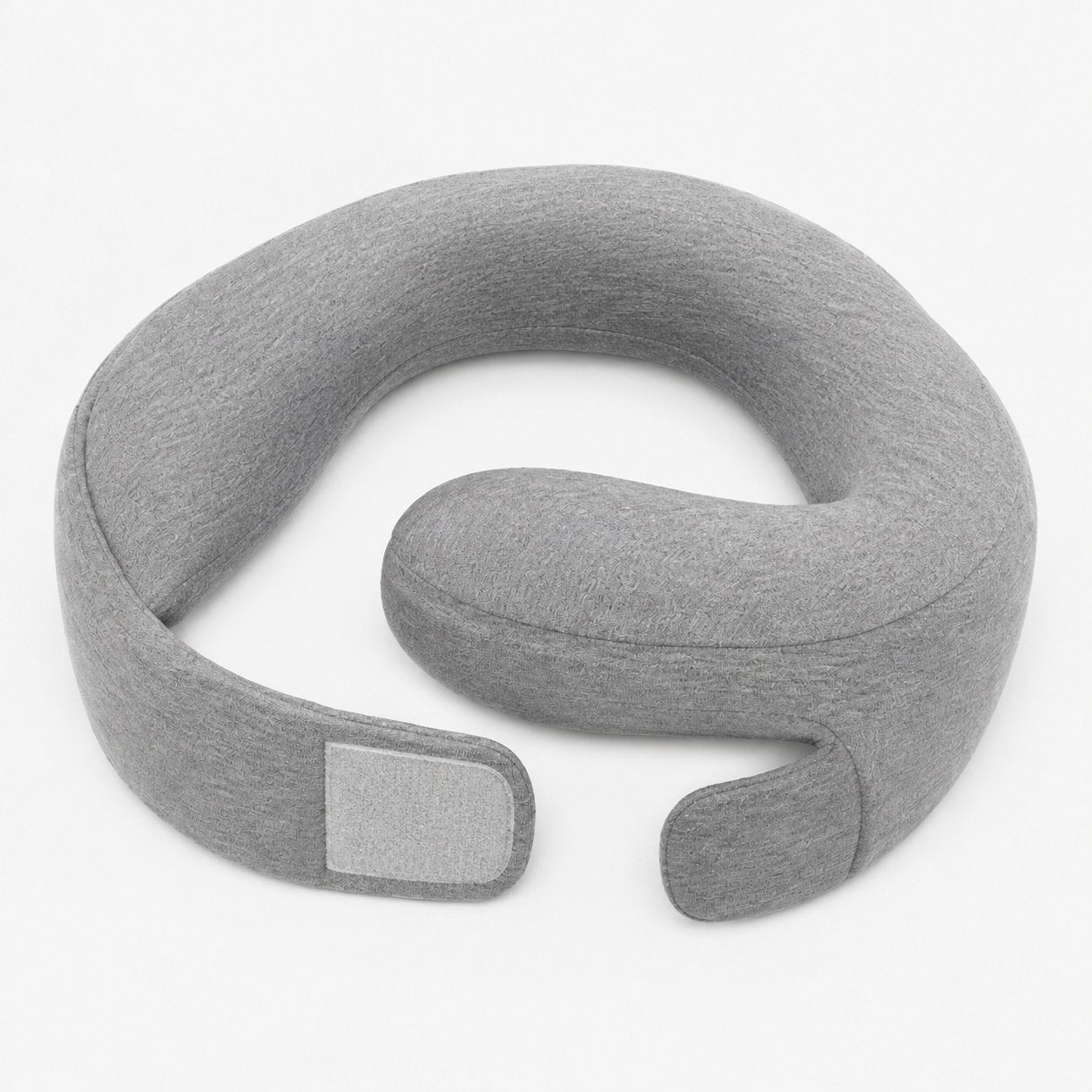 The Pomence Wrap Travel Neck Pillow open and unfastened, ready to wrap around the neck