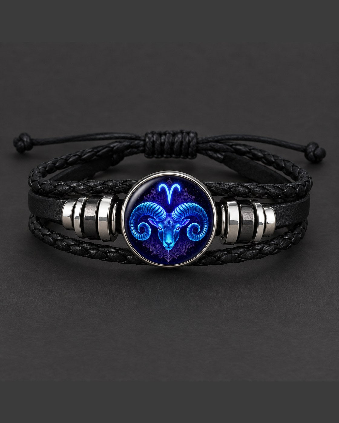 The Pomence Zodiac Leather Bracelet alone on a dark charcoal background, the zodiac dome facing the camera